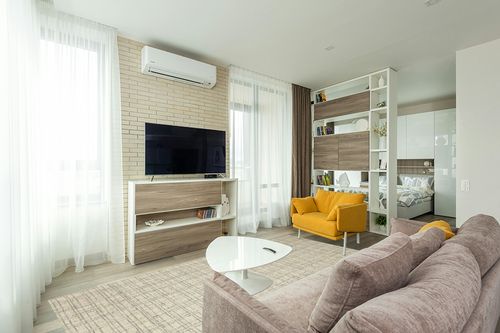 Chris Loves Julia x Loloi Polly Collection POL-03 Antique / Mist 7'-9" x 9'-9" Area Rug in Light Modern Living Room with TV