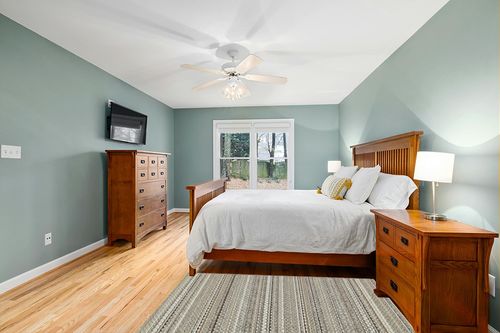 Garland Rug Carnival Stripe 4 ft. x 6 ft. Area Rug EarthTone in Teal and Orange Wood Bedroom