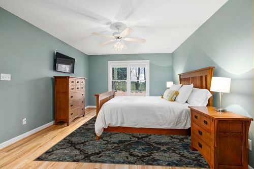 Linon Vintage Collection Grey Clara 9' x 12' Area Rug in Teal and Orange Wood Bedroom