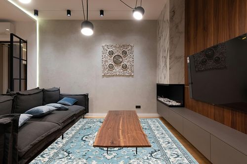 SAFAVIEH Isabella Collection Area Rug - 8' x 10', Light Blue & Cream, Oriental Design, Non-Shedding & Easy Care, Ideal for High Traffic Areas in Living Room, Bedroom (ISA921M) in Dark Wood Living Room with Black Couch