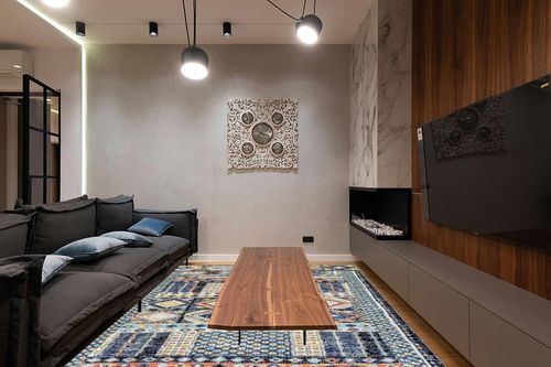 nuLOOM Taliyah Bohemian Fringe Indoor/Outdoor Area Rug, 8x10, Multi in Dark Wood Living Room with Black Couch