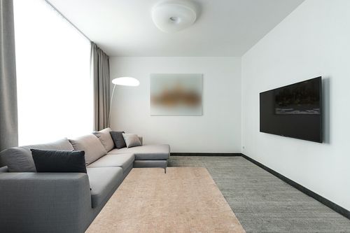 Mohawk Home 5' x 8' Non Slip Rug Pad Gripper 1/4 Thick Dual Surface Felt + Rubber Gripper - Safe for All Floors in Modern Living Room with Grey Couch