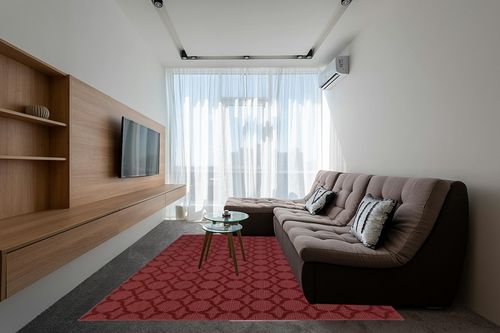 Garland Rug Sparta 8-Feet by 10-Feet Area Rug Chili Red in Grey Living Room with Brown Couch