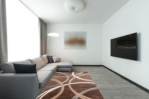 Rugshop Modern Wavy Circles Design Area Rug 5' 3" x 7' 3" Brown in Modern Living Room with Grey Couch