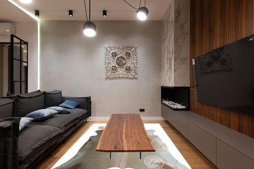 Genuine Champagne Cowhide Rug XL 6 x 7-8 ft. 180 x 240 cm in Dark Wood Living Room with Black Couch