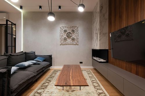 Mark&Day Area Rugs, 6x9 Goldville Traditional Beige/Moss Area Rug, Green/Brown/Grey Carpet for Living Room, Bedroom or Kitchen (5'6" x 8'6") in Dark Wood Living Room with Black Couch