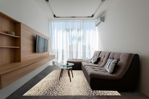 Dalyn Rugs Akina Antelope Animal Print AK3 Faux Fur Stone 8' x 10' in Grey Living Room with Brown Couch