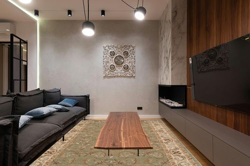 Superior Indoor Area Rug, Jute Backed Rugs for Bedroom, Living/Dining Room, Office, Entryway, Hallway, Kitchen, Traditional Floral Scroll Floor Decor, Heritage Collection, Green, 8' x 10' in Dark Wood Living Room with Black Couch
