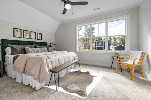 Sunshine Cowhides Genuine Taupe Cowhide Rug - Luxurious Cow Rug for Bedroom, Living Room, and Home Decor Enthusiasts - Masterpiece of Style and Functionality - 6x6-7ft (180x210cm) in Grey Traditional Bedroom with King Bed