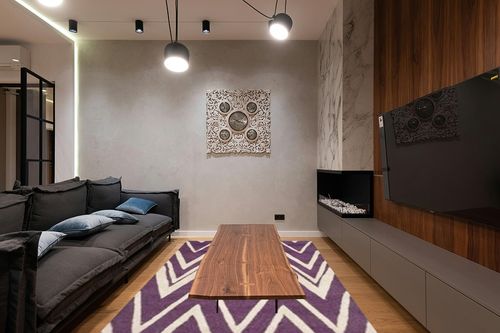 SAFAVIEH Cambridge Collection Area Rug - 6' x 9', Purple & Ivory, Handmade Chevron Wool, Ideal for High Traffic Areas in Living Room, Bedroom (CAM711P) in Dark Wood Living Room with Black Couch
