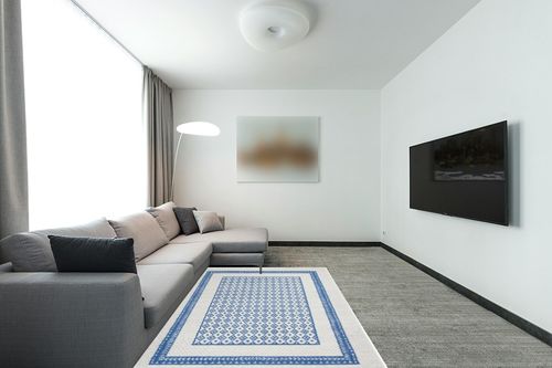 HomeRoots 5' X 7' Navy Blue Geometric Dhurrie Area Rug in Modern Living Room with Grey Couch