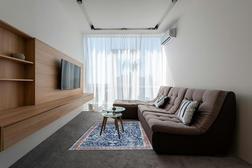 COZYLOOM 5x7 Vintage Bohemian Distressed Rug Oriental Floral Printed Rug Boho Chenille Soft Floor Cover for Living Room Bedroom Non-Slip Low Pile Washable Rug Foldable Thin Blue in Grey Living Room with Brown Couch
