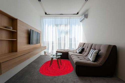 Safavieh Braided Collection Area Rug - 5' x 8' Oval, Red, Handmade Country Farmhouse Reversible Cotton, Ideal for High Traffic Areas in Living Room, Bedroom (BRD452Q) in Grey Living Room with Brown Couch
