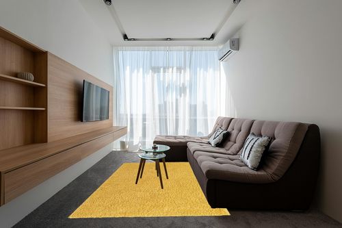 Yellow 6x9 Shag Rug in Grey Living Room with Brown Couch