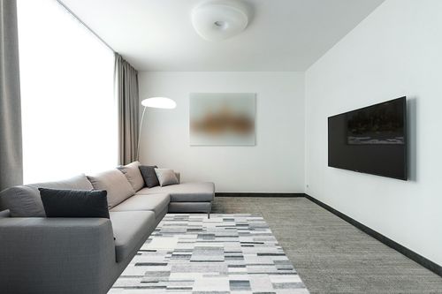 COZYLOOM Modern Geometric Rug 5x7 Contemporary Distressed Area Rug Low Pile Non-Shedding Living Room Rug Indoor Floor Cover Bedroom Home Office Dorm Dining Room Throw Carpet Non Slip Thin Grey in Modern Living Room with Grey Couch