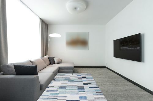 COZYLOOM Modern Geometric Rug 5x7 Contemporary Distressed Area Rug Low Pile Non-Shedding Living Room Rug Indoor Floor Cover Bedroom Home Office Dorm Dining Room Throw Carpet Non Slip Thin Blue/Green in Modern Living Room with Grey Couch