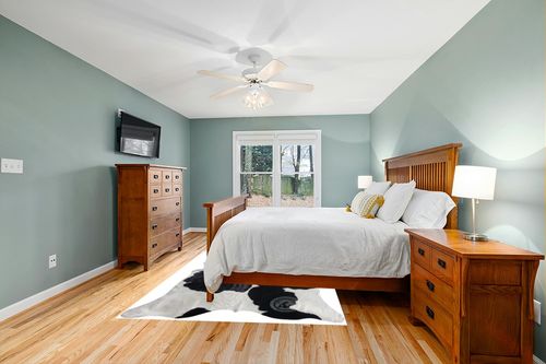 Genuine Black and White Cowhide Rug XL 6 x 7-8 ft. 180 x 240 cm in Teal and Orange Wood Bedroom