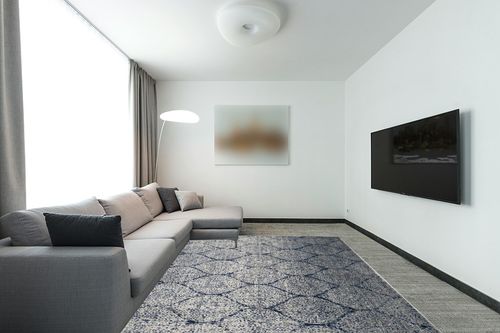 SAFAVIEH Madison Collection Area Rug - 8' x 10', Navy & Silver, Glam Ogee Trellis Distressed Design, Non-Shedding & Easy Care, Ideal for High Traffic Areas in Living Room, Bedroom (MAD604G) in Modern Living Room with Grey Couch