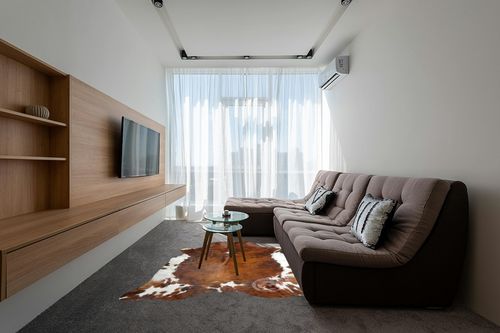 Sunshine Cowhides Genuine Brindle Tricolor Cowhide Rug - Luxurious Cow Rug for Bedroom, Living Room, and Home Decor Enthusiasts - Masterpiece of Style and Functionality - 6x6-7ft (180x210cm) in Grey Living Room with Brown Couch