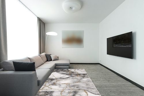 SAFAVIEH Craft Collection Area Rug - 5'3" x 7'6", Grey & Gold, Modern Abstract Design, Non-Shedding & Easy Care, Ideal for High Traffic Areas in Living Room, Bedroom (CFT877F) in Modern Living Room with Grey Couch