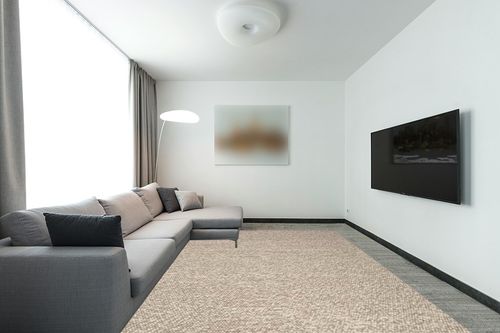 SAFAVIEH Natura Collection Area Rug - 9' x 12', Beige, Handmade Wool, Ideal for High Traffic Areas in Living Room, Bedroom (NAT620B) in Modern Living Room with Grey Couch
