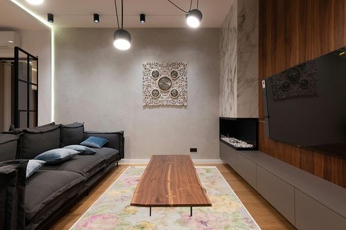 SAFAVIEH Kenya Collection Area Rug - 6' x 9', Pink & Grey, Hand-Knotted Floral Tassel Wool, Ideal for High Traffic Areas in Living Room, Bedroom (KNY802P) in Dark Wood Living Room with Black Couch