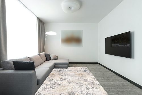nuLOOM Danae Abstract Machine Washable Area Rug, 6x9, Ivory in Modern Living Room with Grey Couch