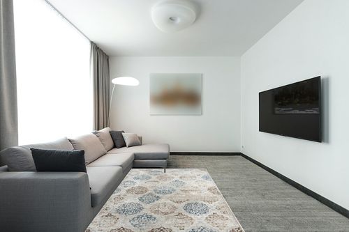 Home Dynamix Boho Andorra Transitional Damask Area Rug, Ivory/Navy Blue, 5'2"x7'2" in Modern Living Room with Grey Couch