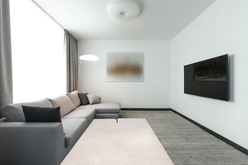 JONATHAN Y SCN100B-5 Skagen Minimalist Curve Geometric Indoor Area Rug, Modern, Contemporary, Coastal, Geometric, Bohemian, Bedroom, Kitchen, Living Room, Non Shedding, Ivory/Cream, 5' x 8' in Modern Living Room with Grey Couch