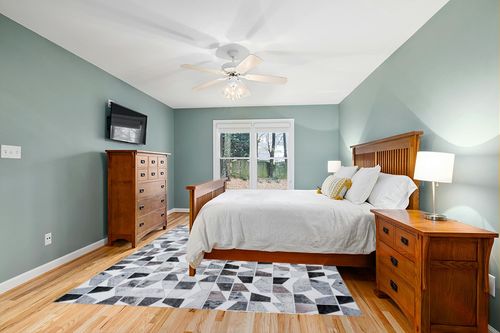 DECOMALL Coronado 8x10ft Area Rugs, Modern Geometric Faux Cowhide Patchwork Rug, Machine Washable Non Slip Carpet for Living Room Bedroom Dinning Room,8x10ft Multi in Teal and Orange Wood Bedroom