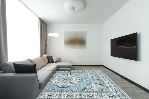 SAFAVIEH Isabella Collection Area Rug - 8' x 10', Light Blue & Cream, Oriental Design, Non-Shedding & Easy Care, Ideal for High Traffic Areas in Living Room, Bedroom (ISA921M) in Modern Living Room with Grey Couch