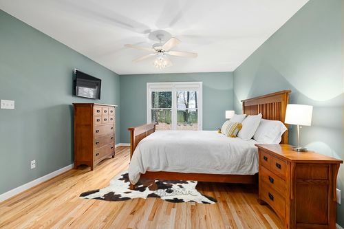Tricolor Cowhide Rug Classic Brown, Black and White Color Mix, Natural Leather Hide, Area Rug (6x8ft) in Teal and Orange Wood Bedroom