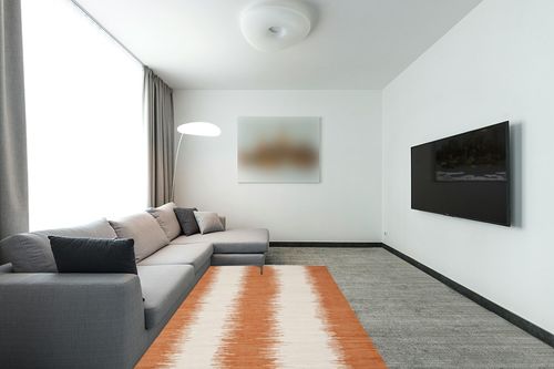 SAFAVIEH Montauk Collection Area Rug - 5' x 8', Orange, Handmade Stripe Fringe Cotton, Ideal for High Traffic Areas in Living Room, Bedroom (MTK751C) in Modern Living Room with Grey Couch