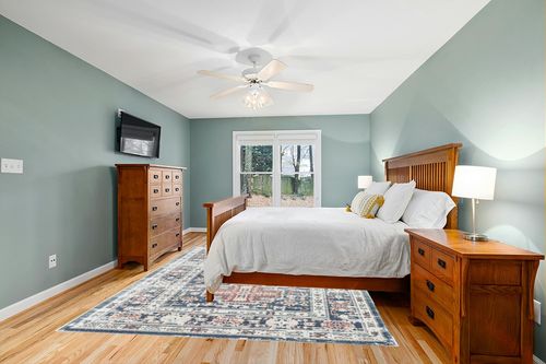 Rugs America Gallagher Collection GL55C Prussian Sundara Transitional Vintage Area Rug 8' x 10' in Teal and Orange Wood Bedroom