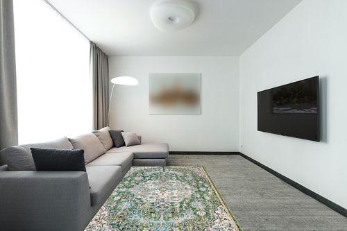SAFAVIEH Madison Collection Area Rug - 5'3" x 7'6", Green & Turquoise, Boho Chic Medallion Distressed Design, Non-Shedding & Easy Care, Ideal for High Traffic Areas in Living Room, Bedroom (MAD447Y) in Modern Living Room with Grey Couch