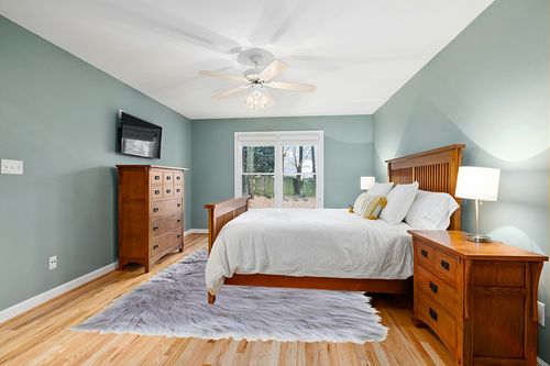 Ultra Soft & Fluffy Faux Sheepskin Rug in Teal and Orange Wood Bedroom