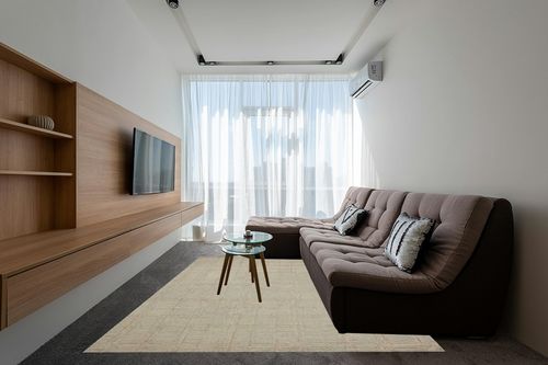 Loloi Chris Loves Julia x Polly Fog/Wheat 7'-9" x 9'-9" Area Rug in Grey Living Room with Brown Couch