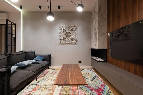 SAFAVIEH Monaco Collection Area Rug - 9' x 12', Multi, Boho Chic Tribal Distressed Design, Non-Shedding & Easy Care, Ideal for High Traffic Areas in Living Room, Bedroom (MNC222F) in Dark Wood Living Room with Black Couch