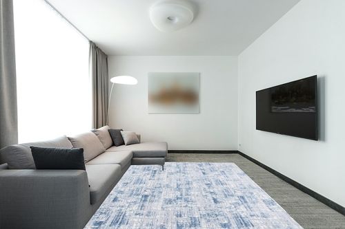 SAFAVIEH Amelia Collection Area Rug - 8' x 10', Navy & Light Grey, Modern Abstract Distressed Design, Non-Shedding & Easy Care, Ideal for High Traffic Areas in Living Room, Bedroom (ALA786N) in Modern Living Room with Grey Couch