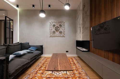 SAFAVIEH Aspen Collection Area Rug - 6' x 9', Brown & Purple, Handmade Southwestern Tribal Wool, Ideal for High Traffic Areas in Living Room, Bedroom (APN127T) in Dark Wood Living Room with Black Couch