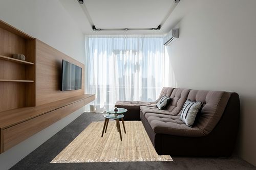 nuLOOM Daniela Farmhouse Chunky Jute Area Rug, 6' x 9', Natural in Grey Living Room with Brown Couch
