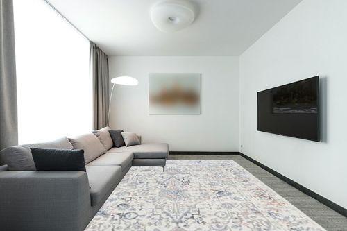 nuLOOM Everlee Faded Persian Machine Washable Area Rug - 9x12 Machine Washable Area Rug Traditional Light Beige/Ivory Rugs for Living Room Bedroom Dining Room Kitchen in Modern Living Room with Grey Couch
