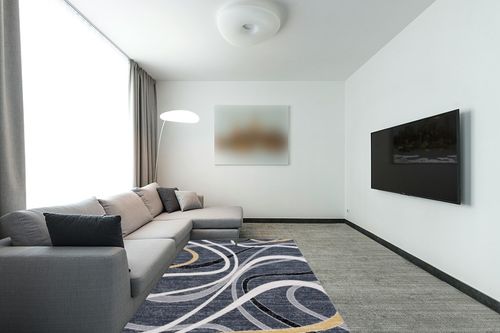 Safavieh Odyssey Collection Area Rug - 5'3" x 7'6", Black & Grey Gold, Modern Abstract Design, Non-Shedding & Easy Care, Ideal for High Traffic Areas in Living Room, Bedroom (ODY812Z) in Modern Living Room with Grey Couch