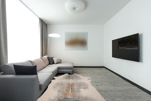 Loloi II Bryce Collection BZ-07 Pewter/Gold, Contemporary 5' x 6'-6" Area Rug in Modern Living Room with Grey Couch