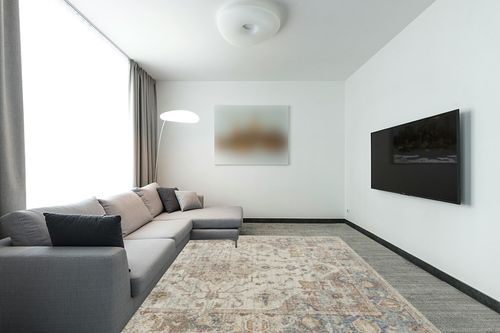 LUXE WEAVERS Freesia Collection 2384 Cream 8x10 Floral Pattern Area Rug in Modern Living Room with Grey Couch