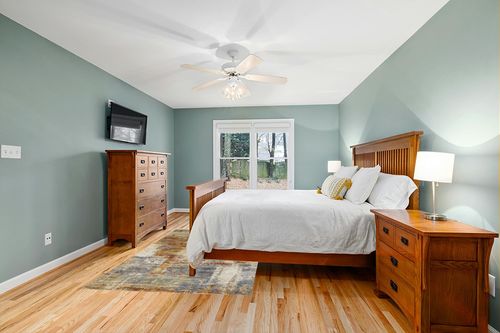 Haltwhistle Abstract Terracotta Area Rug 17 Stories Rug Size: Rectangle 5'3" x 7'8" in Teal and Orange Wood Bedroom