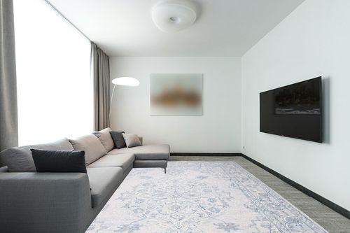 SAFAVIEH Micro-Loop Collection Area Rug - 9' x 12', Light Blue & Ivory, Handmade Shabby Chic Wool, Ideal for High Traffic Areas in Living Room, Bedroom (MLP504M) in Modern Living Room with Grey Couch