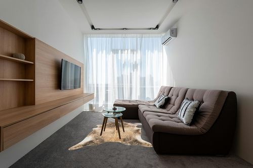 Loloi II Odessa Collection ODE-01 Mocha/Sand 5' x 6'-6" Area Rug in Grey Living Room with Brown Couch