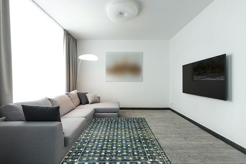 Loloi Rifle Paper Co. x Eden Lattice Indigo 5'-0" x 7'-6" Area Rug in Modern Living Room with Grey Couch