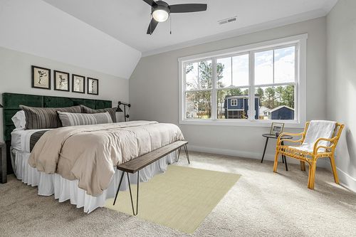 HomeRoots 5' X 7' Green Geometric Power Loom Area Rug in Grey Traditional Bedroom with King Bed